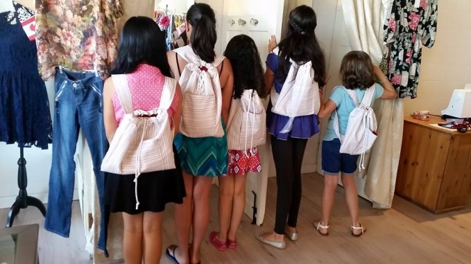 kids modeling their homemade backpacks (look ma, no princesses!)  